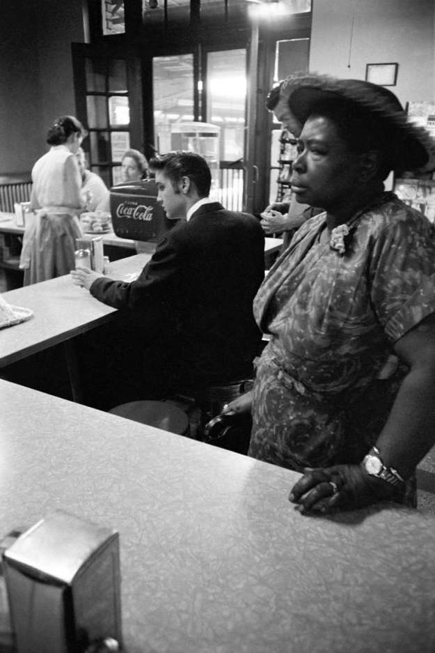 [Photo by Al Wertheimer, Segregated Lunch Counter: Elvis Presley waits for his bacon and eggs at the railroad station lunch counter while a black woman waits for her sandwich, Chatanooga, Tennessee, 1956]